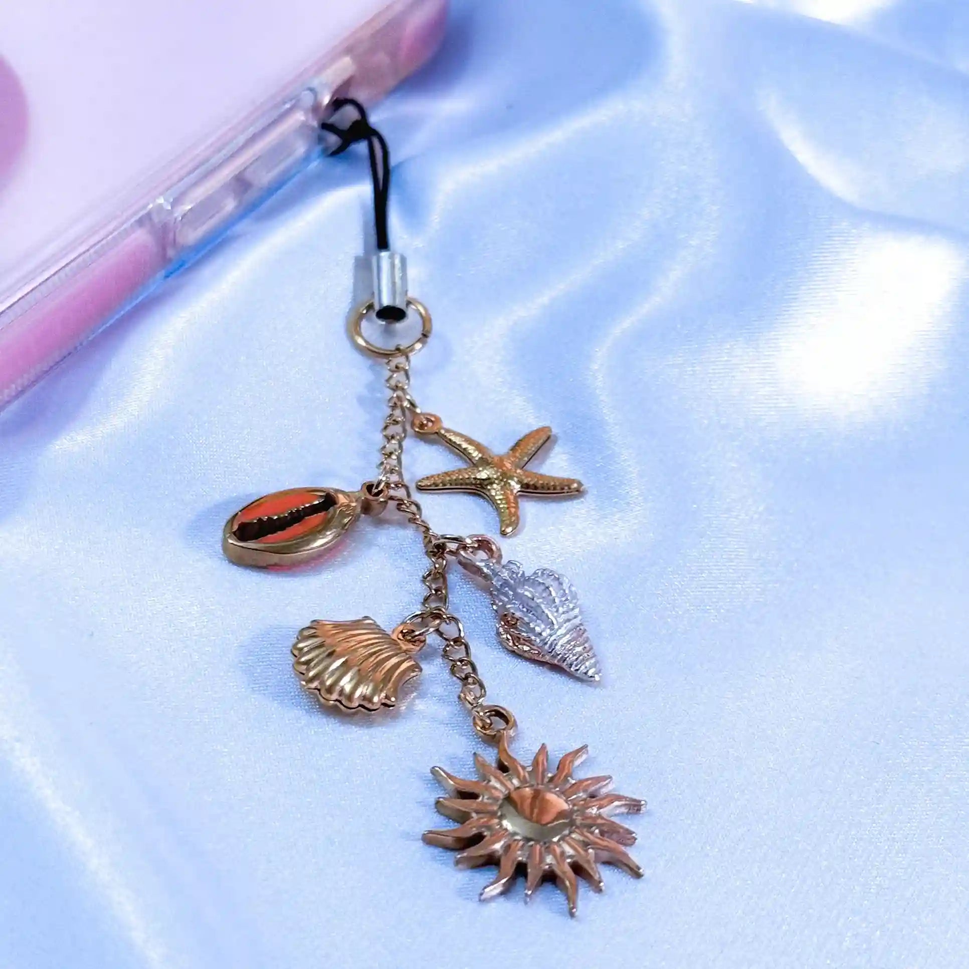 shell phone charm attached